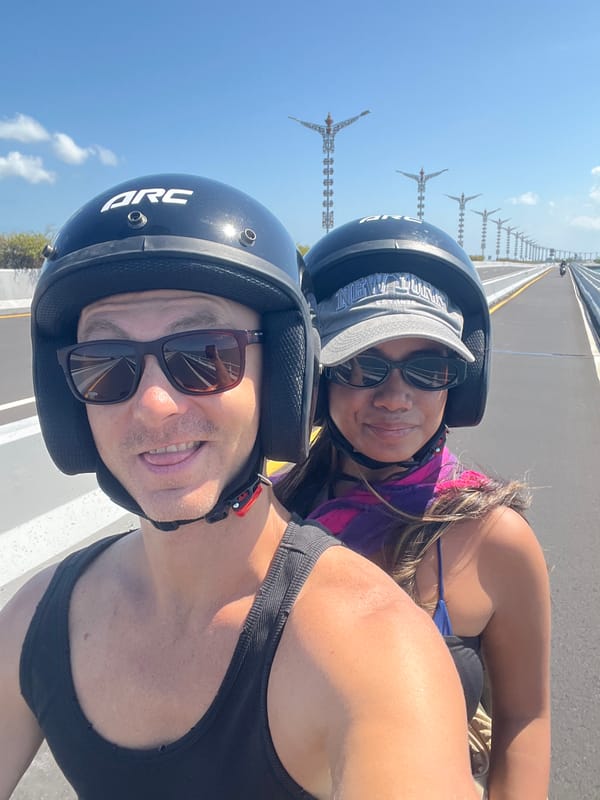 Scooter ride across a Kuta Selatan bridge, Bali