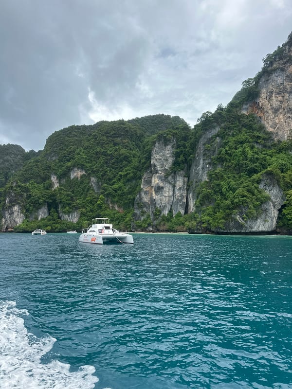 Charter catamaran anchored in Ao Nang's coastal waters