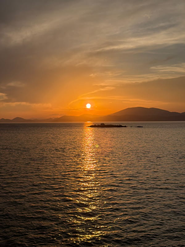 Sunset scenes captured across Hydra harbor and coastline
