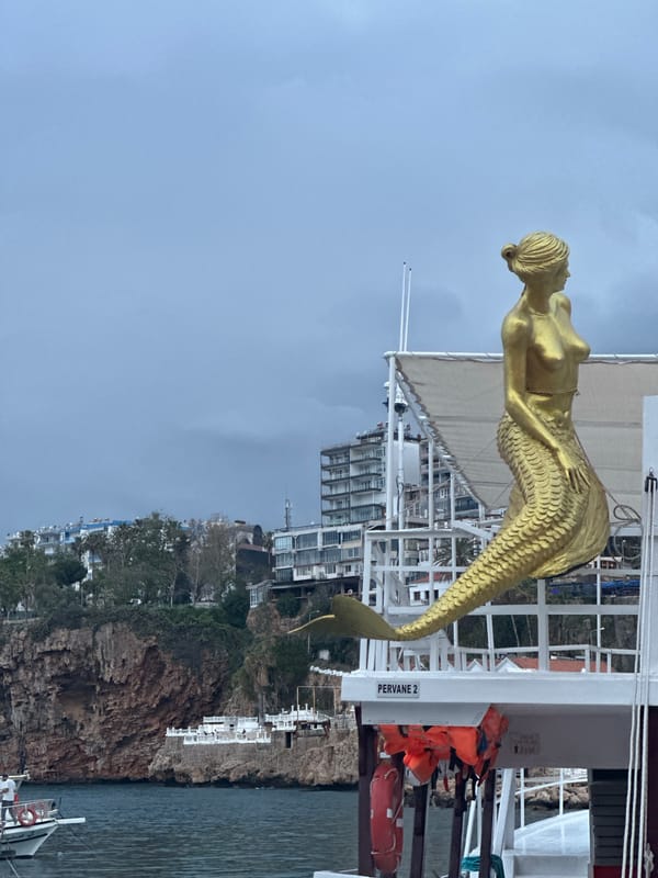 Golden mermaid statue spotted on white boat in Antalya