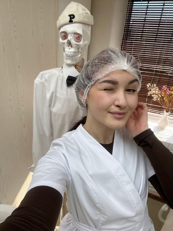 Woman takes selfie with dressed skeleton in Russia