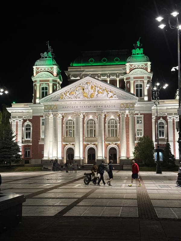 Sofia's National Theatre illuminated in white and green lights