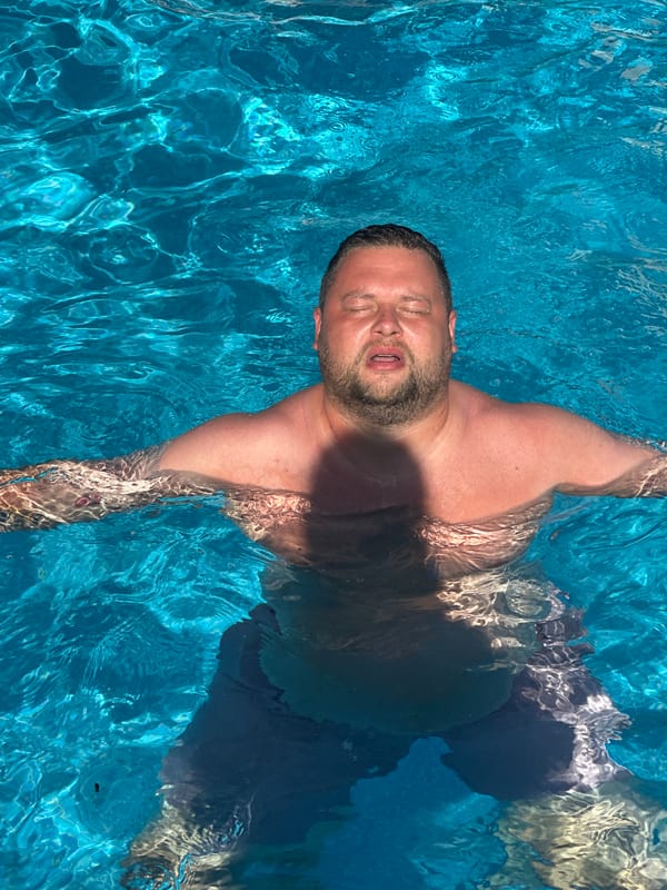 Father and toddler enjoy poolside afternoon in Spanish coastal town