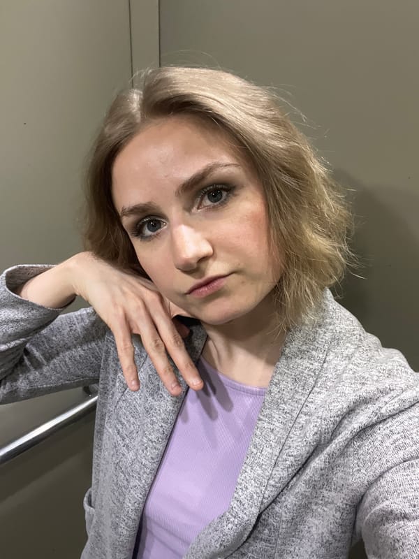 Woman photographed in casual morning setting in Novosibirsk apartment