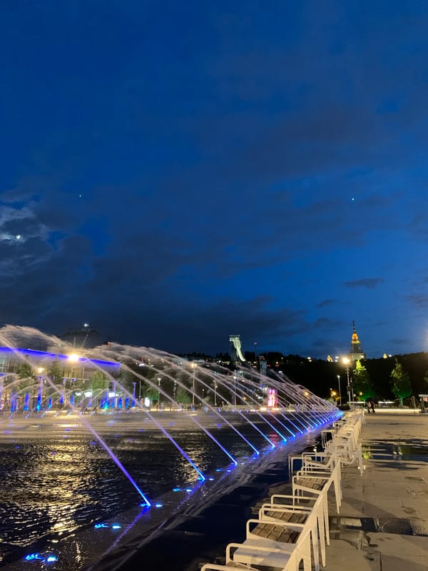 Moscow landmarks glow blue during evening hours across city