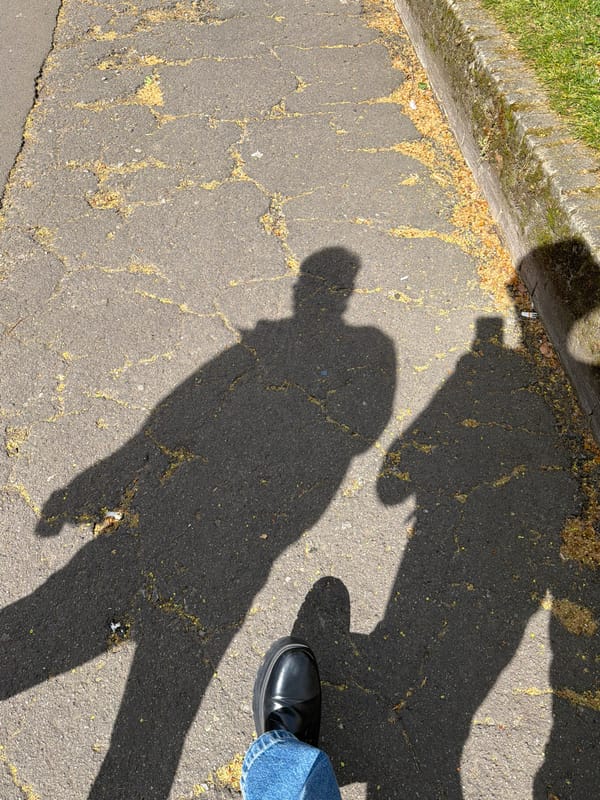 Man photographs statue at Brompton Cemetery in London