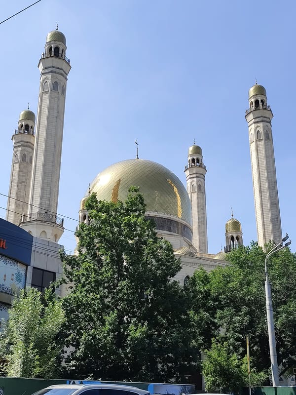 Golden-domed mosque rises under clear skies in Almaty