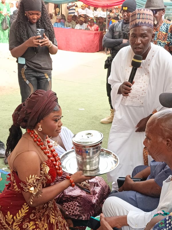Traditional wedding ceremony held outdoors in Sabon Gari West