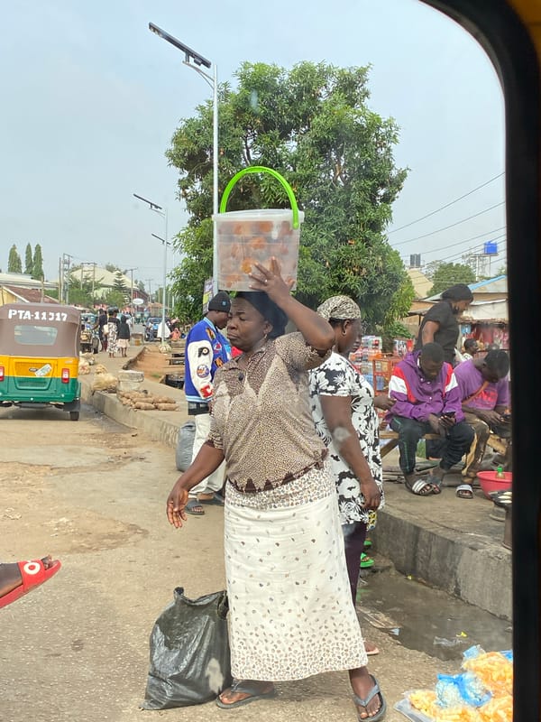 Street vendors conduct morning business in Bukuru, Nigeria