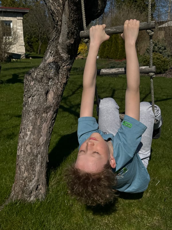 Children play outdoors in sunny Carnikava backyard