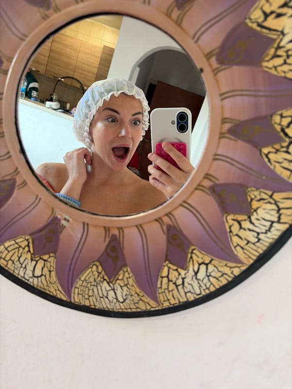 Shower cap selfie in a Budva mirror