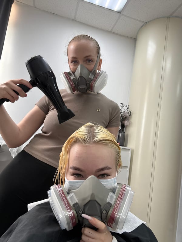 Women wear protective gear during salon visit