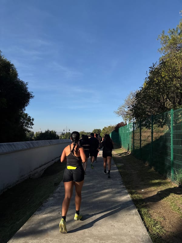 Group jogs along park path in San Andrés Cholula