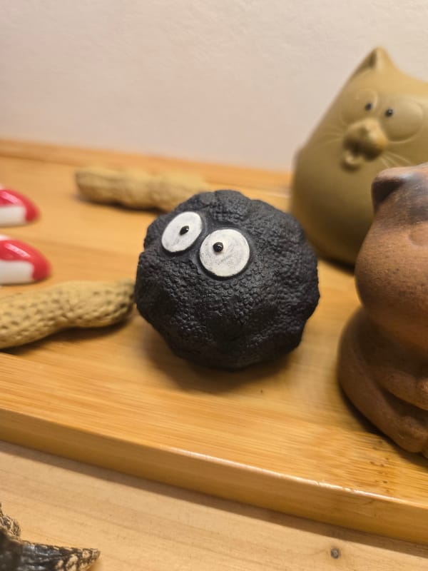 Ceramic figurine collection and tattooed hands documented in Budva