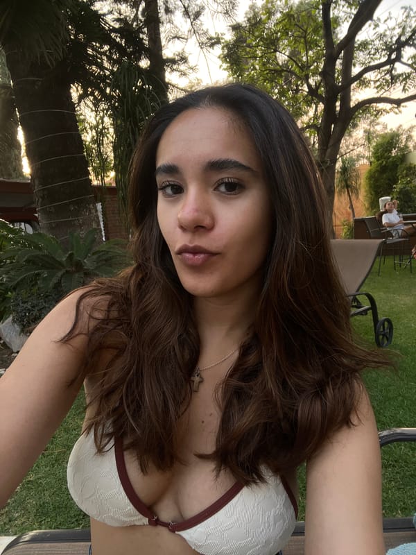 Woman takes poolside selfies in Tenextepec, Mexico