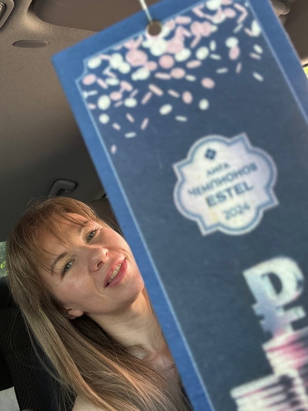Woman displays car air freshener in Tolyatti vehicle