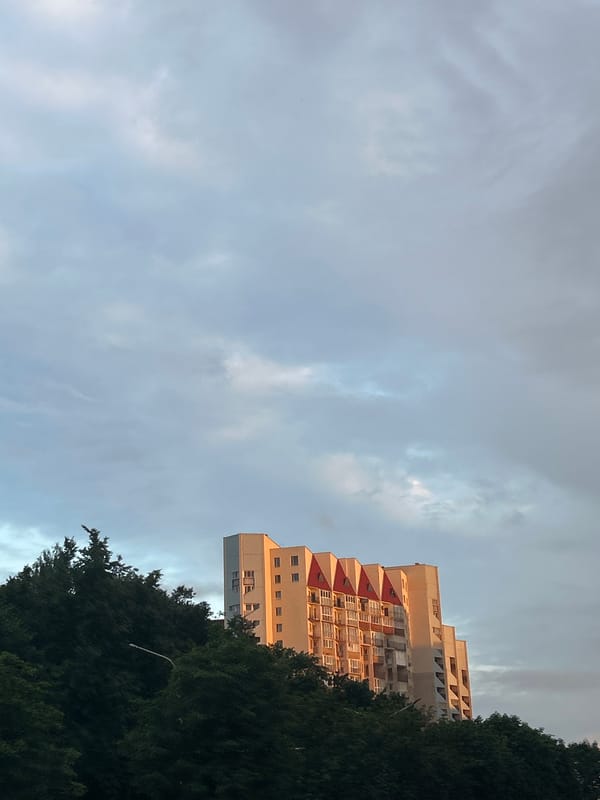 Minsk streets and skyline at golden hour, July 2026
