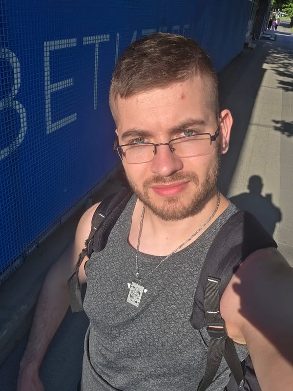 Tourist takes selfie on Plovdiv walkway amid street scene