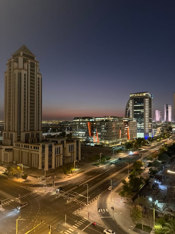 City skyline at dusk, pyramidal skyscraper standing tall