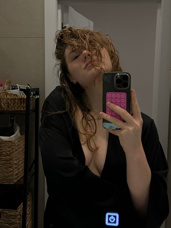 Woman takes selfie in dressing area in Studenets, Russia