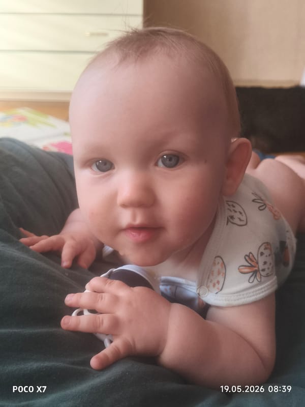 Quiet domestic moments: baby resting, window view captured
