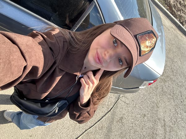Woman photographed in brown outfit at two Izhevsk locations