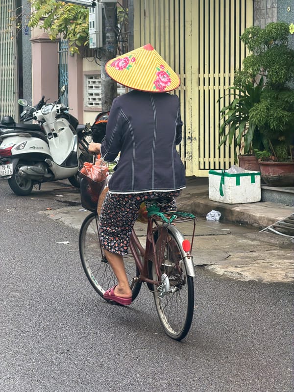 Cyclist in traditional dress spotted on Nha Trang streets