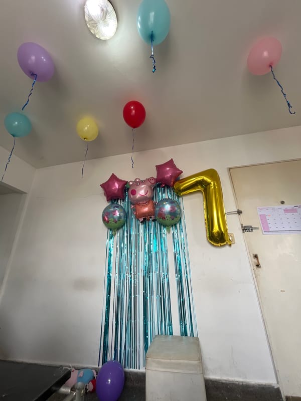 Seventh birthday party celebrated with balloons and decorations