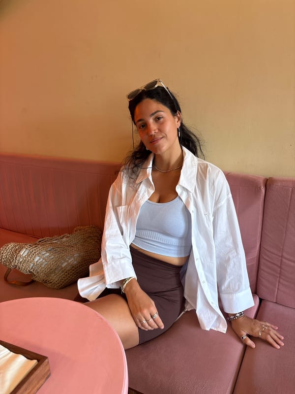 Chilling at a glowy Bali cafe with cinnamon rolls on display
