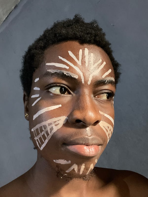 Portrait session with traditional face paint documented in Nkpor