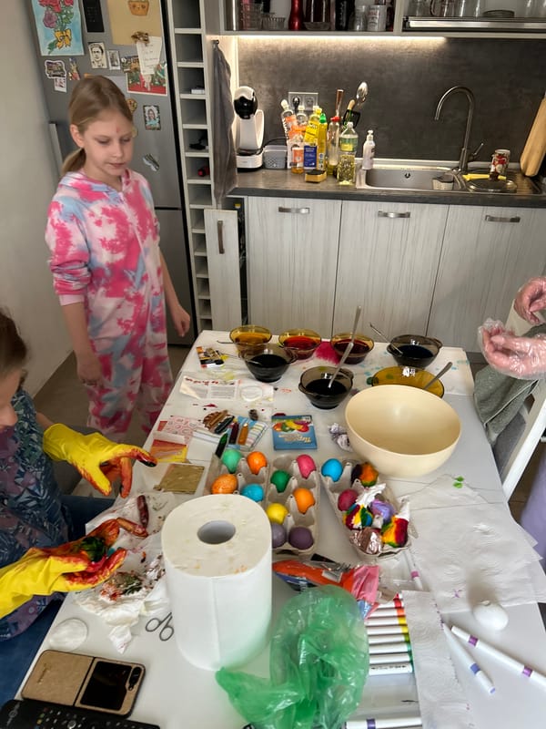 Family dyes Easter eggs in Sofia kitchen
