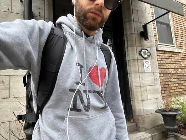 Man in NY-branded hoodie photographed on Montreal street