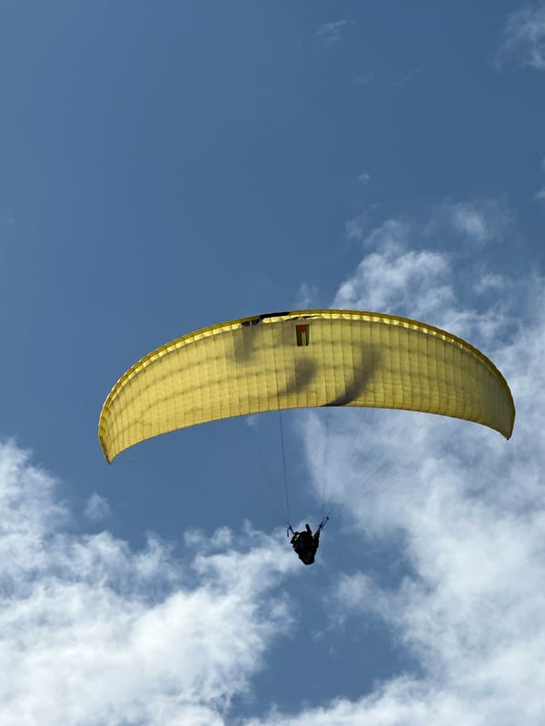 Paragliders soar over Fethiye Turkey in clear skies