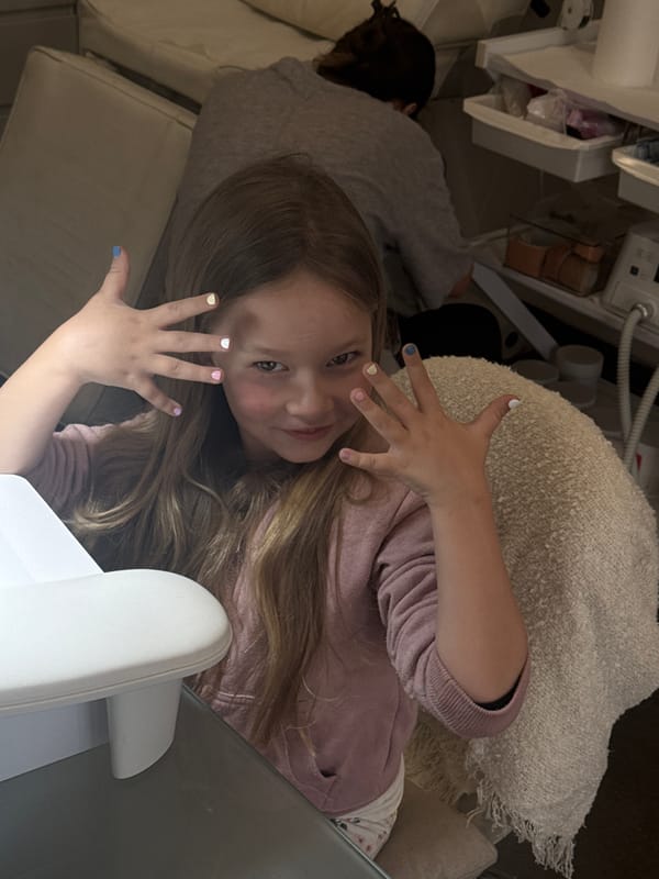 Young girl gets manicure at Bat Yam nail salon