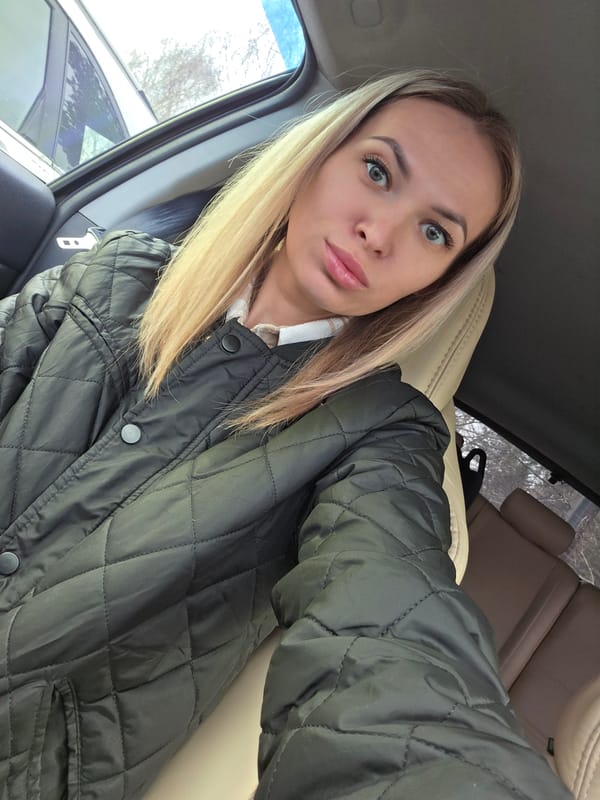 Woman takes car selfies in Chaikovsky, Russia