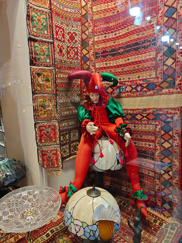 Ornate jester displays and rustic chandelier spotted in Tbilisi shop