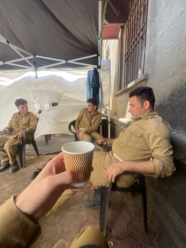 Officials interact with children under tent in Kolhapur