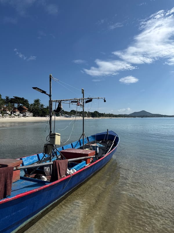 Fishing boat docked in calm Ko Samui coastal waters