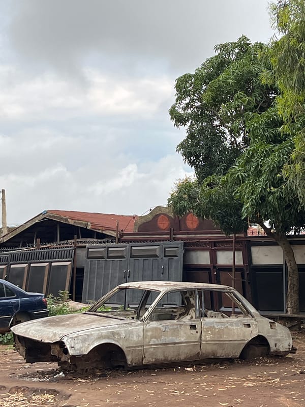 Bukuru streets at dusk: decay, infrastructure, and daily life