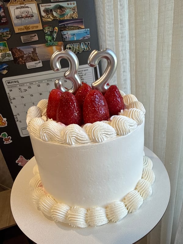 33rd Birthday Celebration Documented in Krasnoyarsk with Cake and Flowers