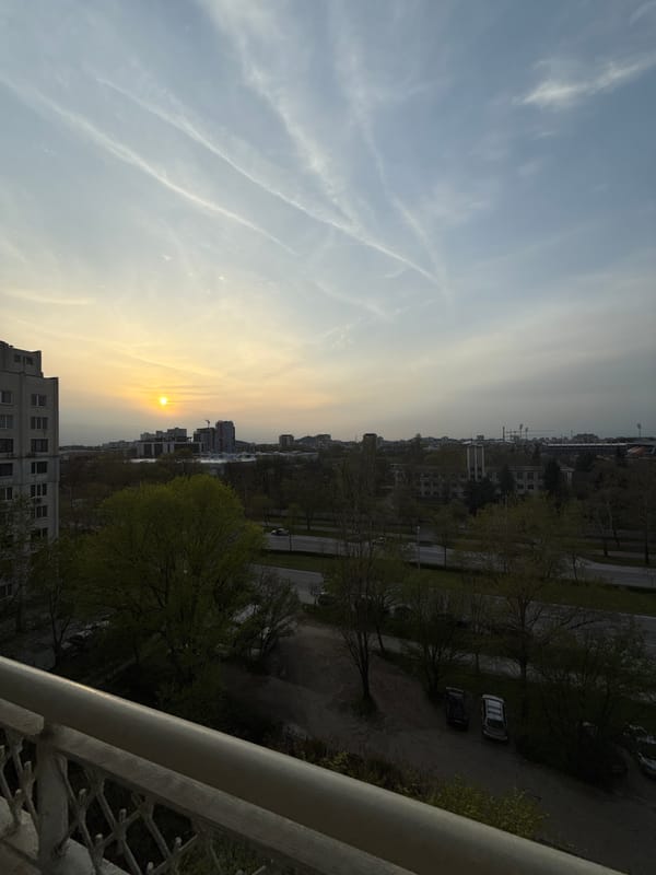 Sunset captured over Пловдив cityscape from high vantage point