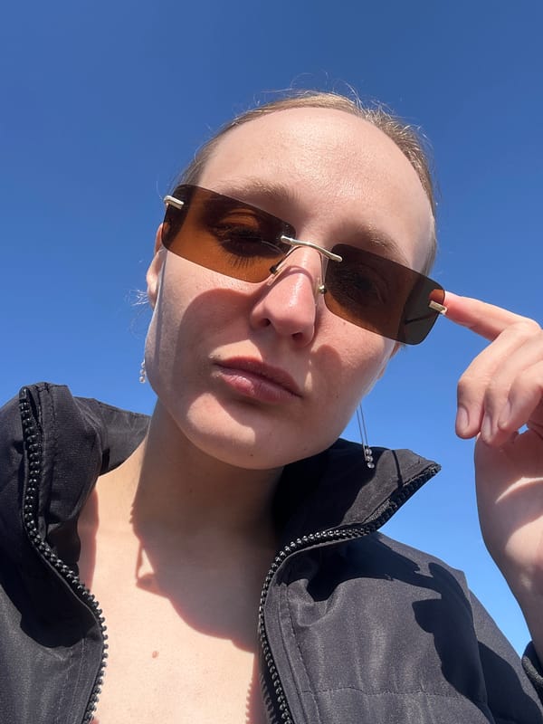 Person documents sunny morning in Russian residential neighborhood