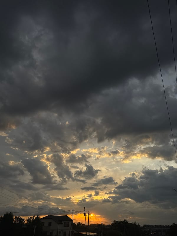 Storm clouds and golden light at sunset in Mikhaylovsk