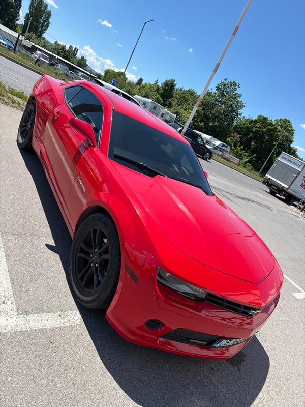 Red Camaro spotted in sunny parking lot