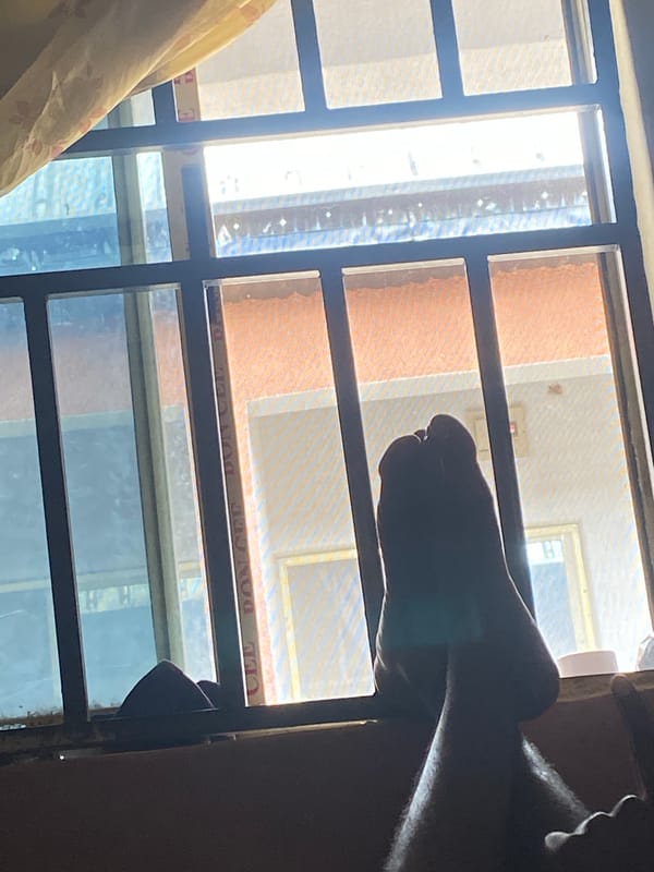 Indoor downtime and neighborhood streets in Jalingo, Nigeria