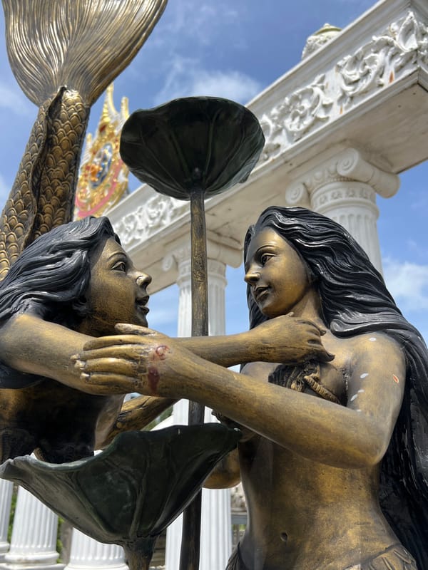 Ornate statues and royal monuments at a Pa Khlok shrine