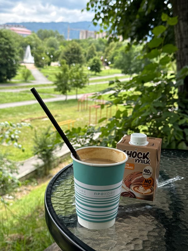 Coffee and protein milk on a glass table in Vladikavkaz