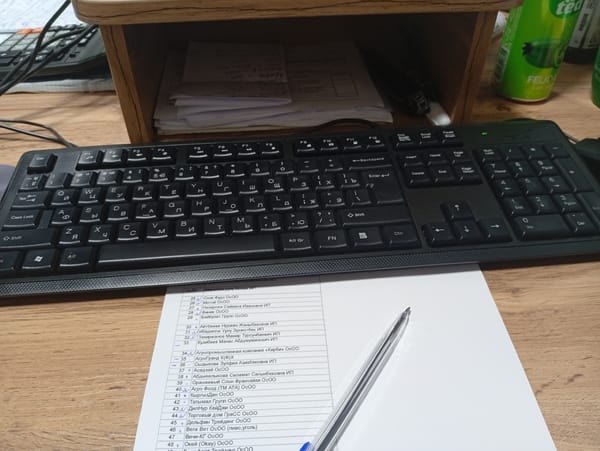 Desk work session in Osh, Kyrgyzstan with business software and notes