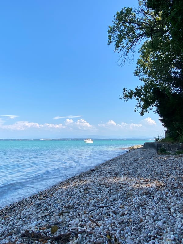 Calm afternoon on Lake Neuchâtel's pebble shore