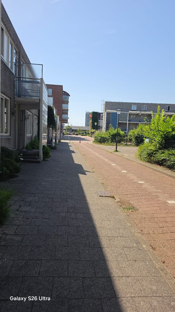 Sunny morning in Vlaardingen: streets, rooftops, and an RET train